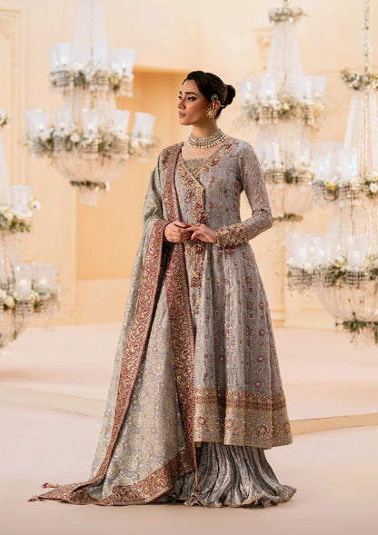 Graceful embroidered chiffon ensemble with organza neckline, silk and organza borders, jamawaar pants, and a chiffon dupatta. Styled as kalidar open front or angrakha sharara.