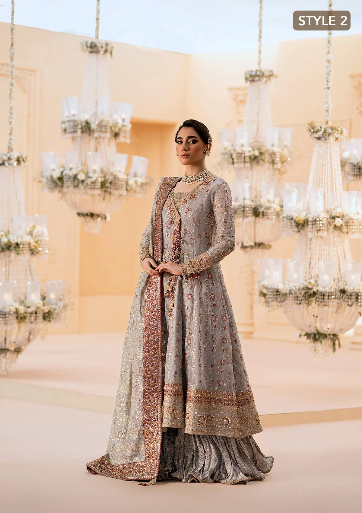 Graceful embroidered chiffon ensemble with organza neckline, silk and organza borders, jamawaar pants, and a chiffon dupatta. Styled as kalidar open front or angrakha sharara.