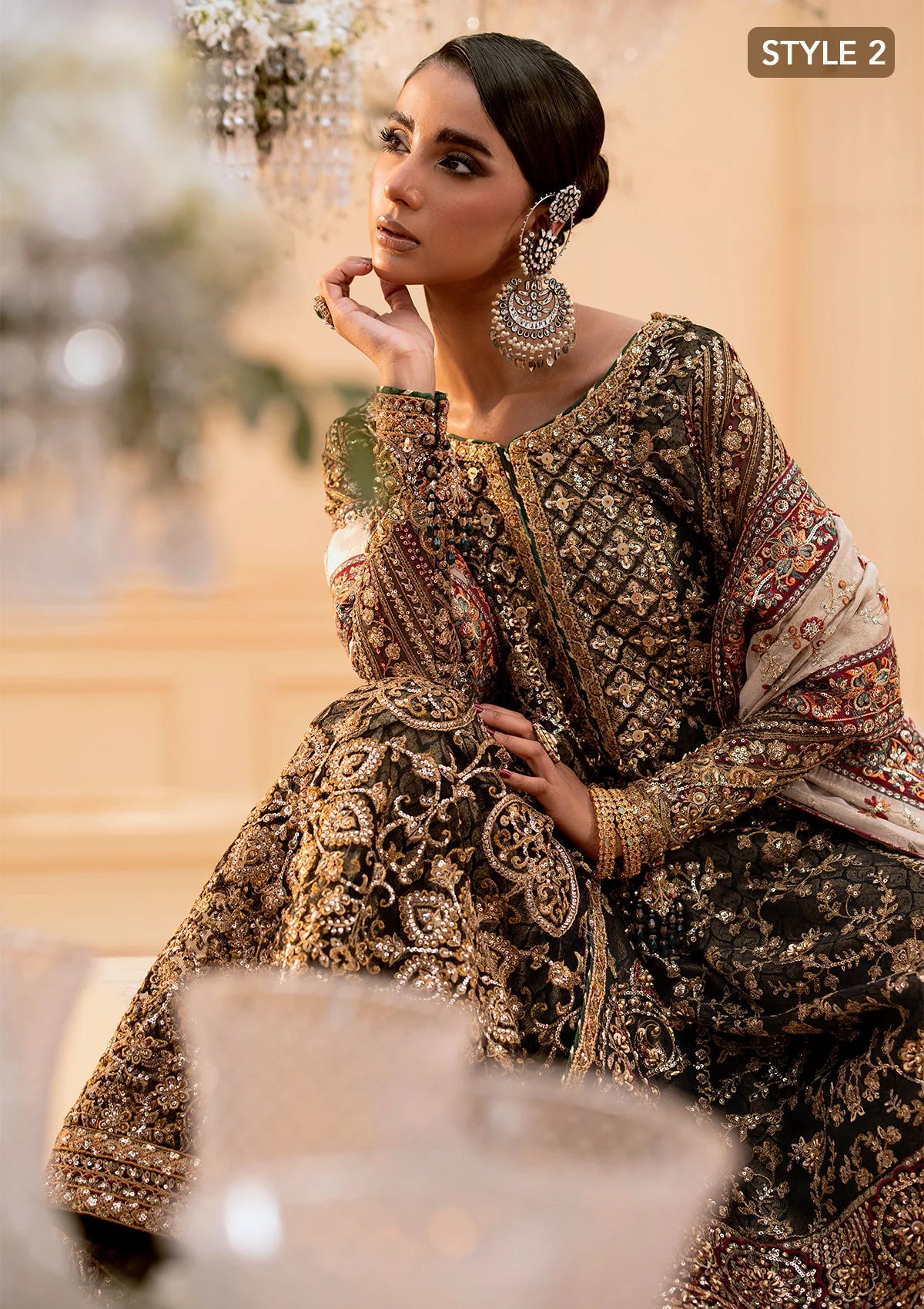 Luxurious organza ensemble with embellished front, intricate borders, jamawaar pants, embroidered net panels, and a tissue jaal dupatta. Styled as a long shirt with lehnga or gharara.