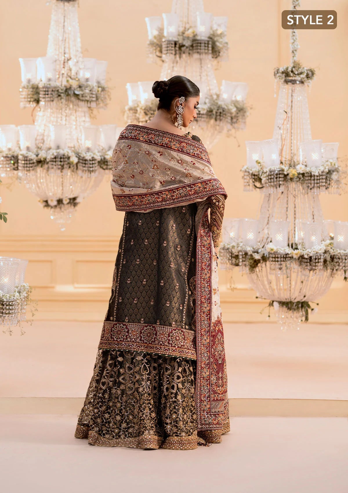 Luxurious organza ensemble with embellished front, intricate borders, jamawaar pants, embroidered net panels, and a tissue jaal dupatta. Styled as a long shirt with lehnga or gharara.