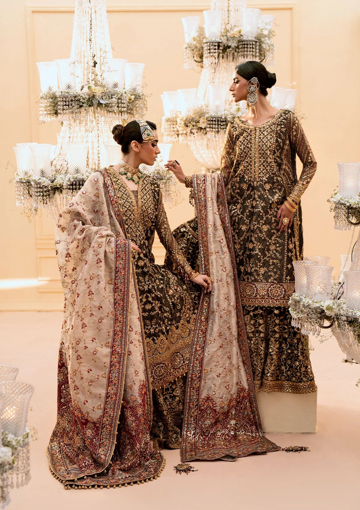 Luxurious organza ensemble with embellished front, intricate borders, jamawaar pants, embroidered net panels, and a tissue jaal dupatta. Styled as a long shirt with lehnga or gharara.