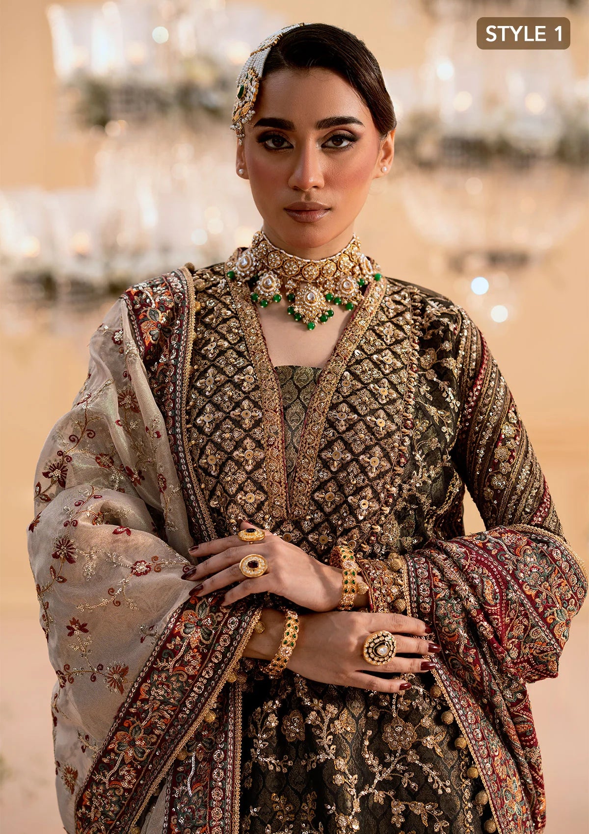 Luxurious organza ensemble with embellished front, intricate borders, jamawaar pants, embroidered net panels, and a tissue jaal dupatta. Styled as a long shirt with lehnga or gharara.