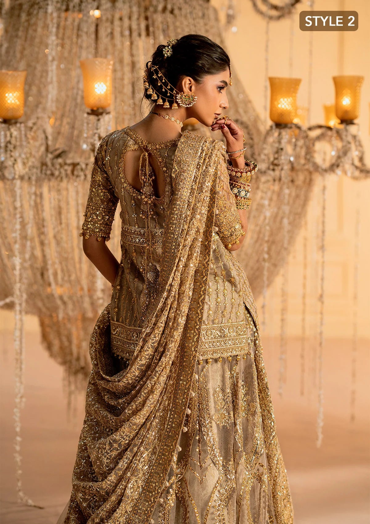 Exquisite embroidered net ensemble with embellished bodice, organza borders, jamawaar pants, and an embroidered net dupatta. Styled as kalidar with crushed skirt or kurti with lehnga.