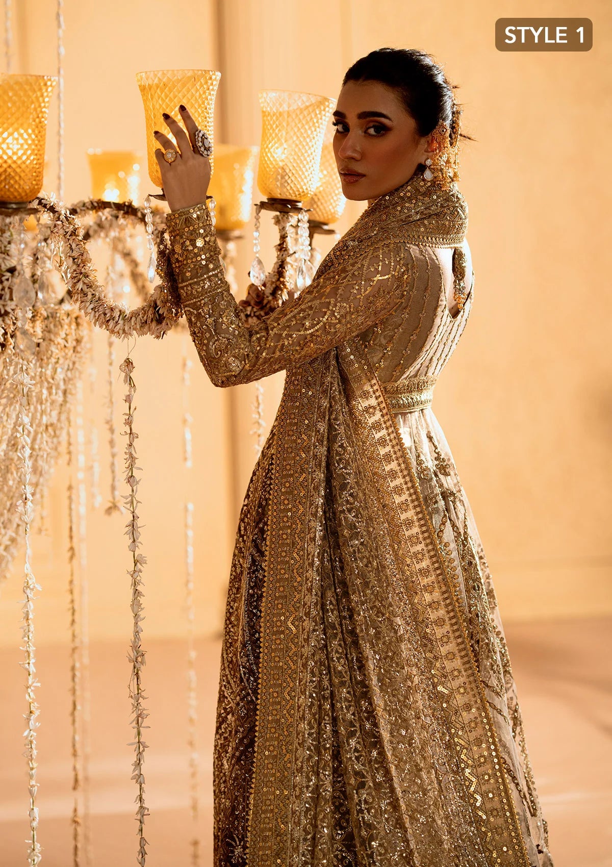 Exquisite embroidered net ensemble with embellished bodice, organza borders, jamawaar pants, and an embroidered net dupatta. Styled as kalidar with crushed skirt or kurti with lehnga.