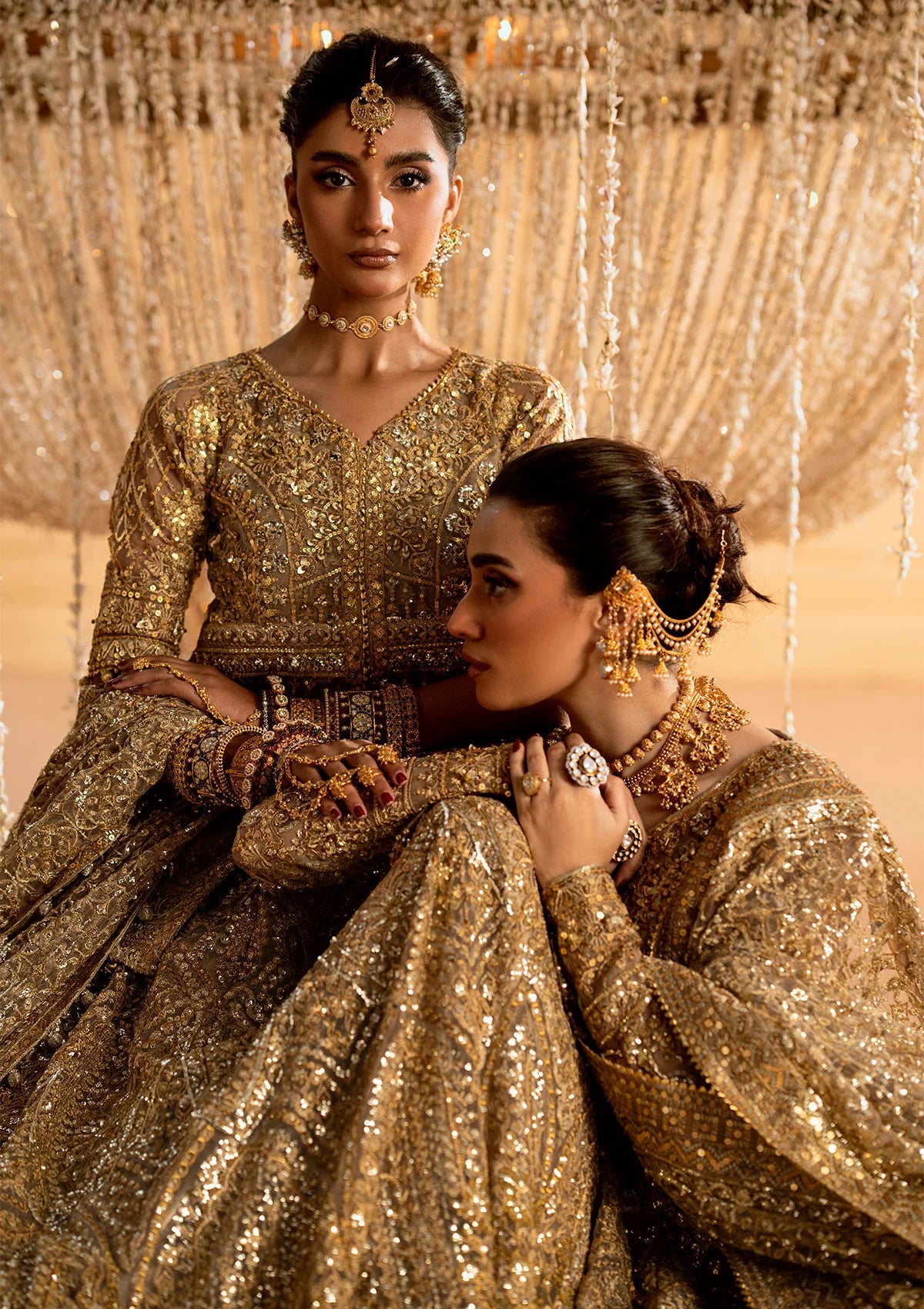 Exquisite embroidered net ensemble with embellished bodice, organza borders, jamawaar pants, and an embroidered net dupatta. Styled as kalidar with crushed skirt or kurti with lehnga.