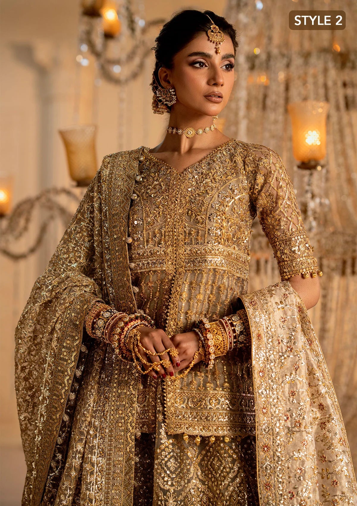 Exquisite embroidered net ensemble with embellished bodice, organza borders, jamawaar pants, and an embroidered net dupatta. Styled as kalidar with crushed skirt or kurti with lehnga.