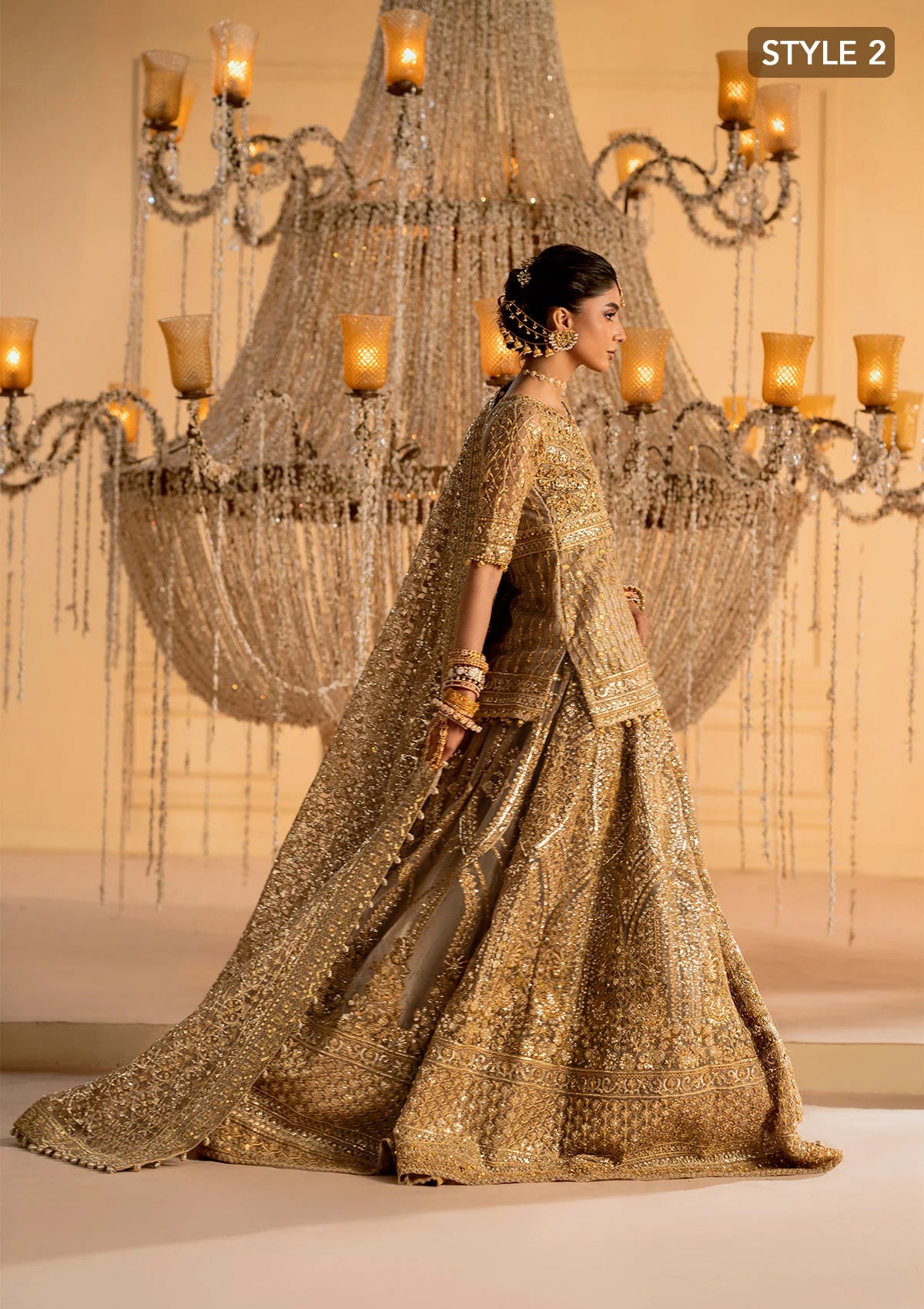 Exquisite embroidered net ensemble with embellished bodice, organza borders, jamawaar pants, and an embroidered net dupatta. Styled as kalidar with crushed skirt or kurti with lehnga.