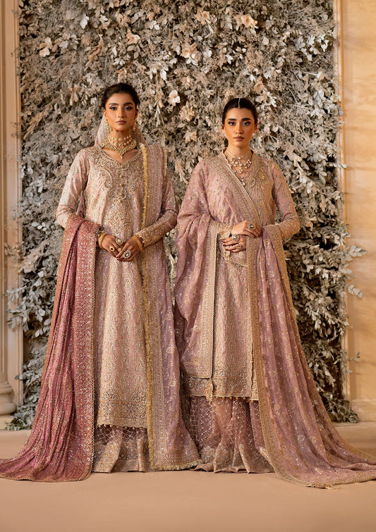 Elegant khaadi net ensemble with embellished organza neckline, detailed borders, masoori silk pants, and chiffon dupatta. Styled as angrakha with gharara or side-slit long shirt with crushed frock.