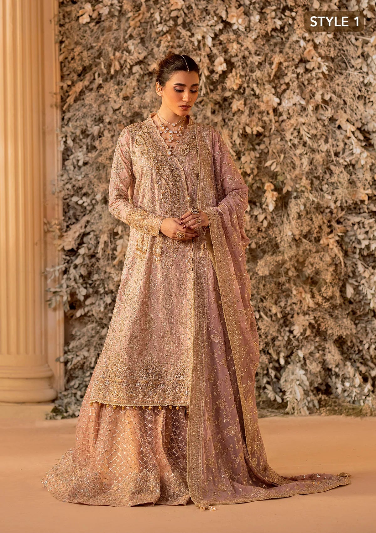 Elegant khaadi net ensemble with embellished organza neckline, detailed borders, masoori silk pants, and chiffon dupatta. Styled as angrakha with gharara or side-slit long shirt with crushed frock.