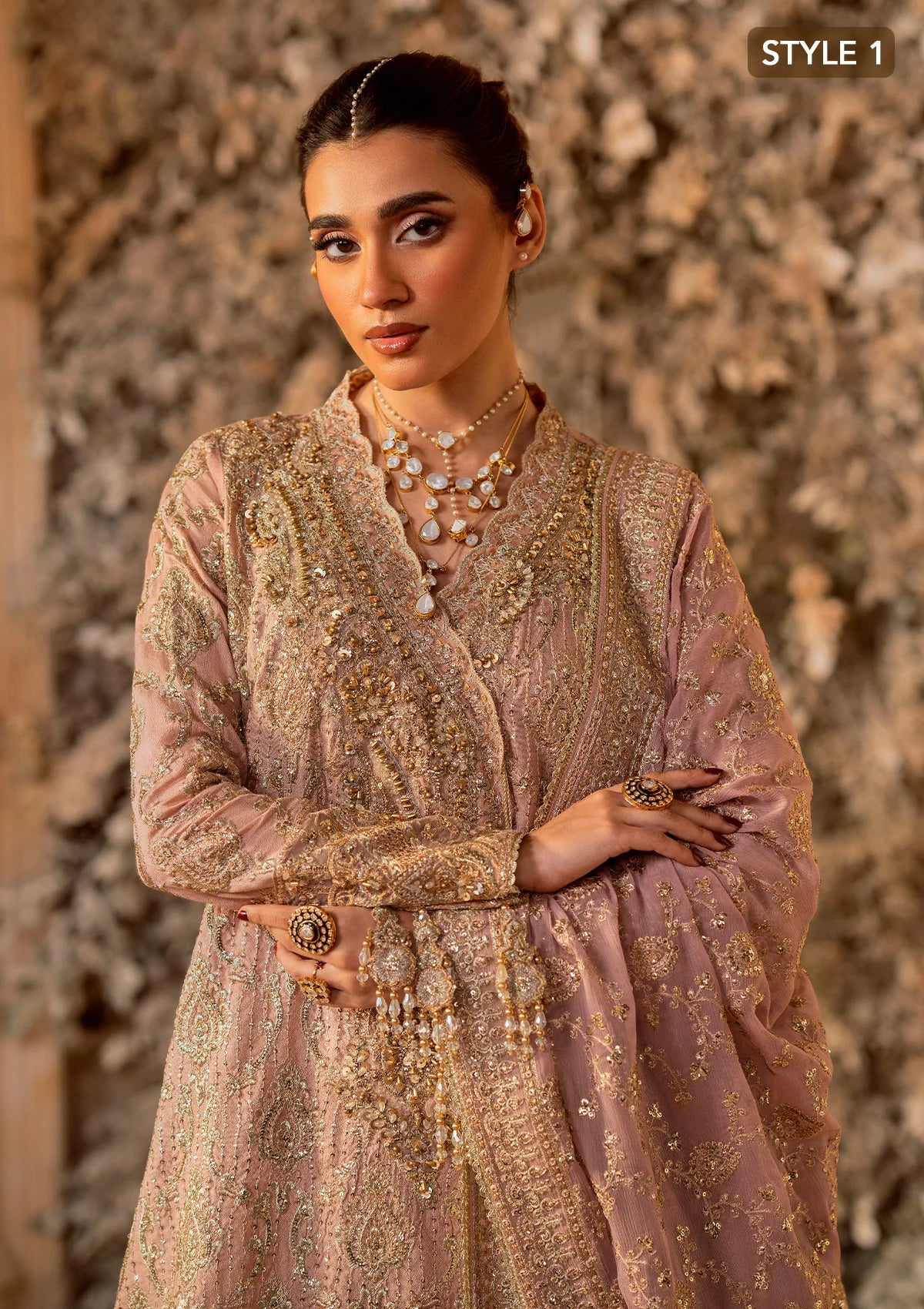 Elegant khaadi net ensemble with embellished organza neckline, detailed borders, masoori silk pants, and chiffon dupatta. Styled as angrakha with gharara or side-slit long shirt with crushed frock.