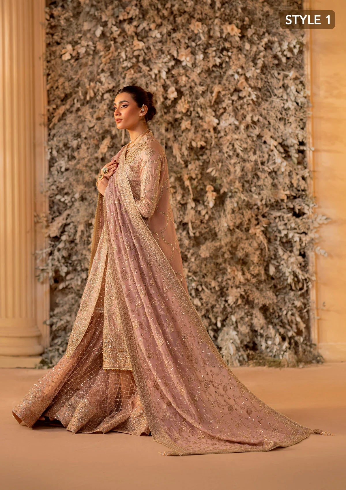 Elegant khaadi net ensemble with embellished organza neckline, detailed borders, masoori silk pants, and chiffon dupatta. Styled as angrakha with gharara or side-slit long shirt with crushed frock.