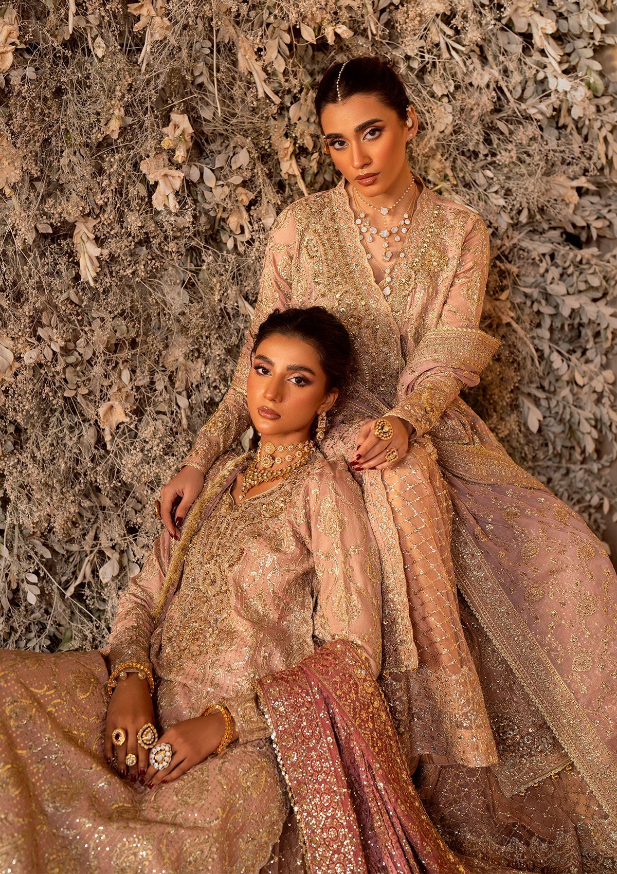 Elegant khaadi net ensemble with embellished organza neckline, detailed borders, masoori silk pants, and chiffon dupatta. Styled as angrakha with gharara or side-slit long shirt with crushed frock.