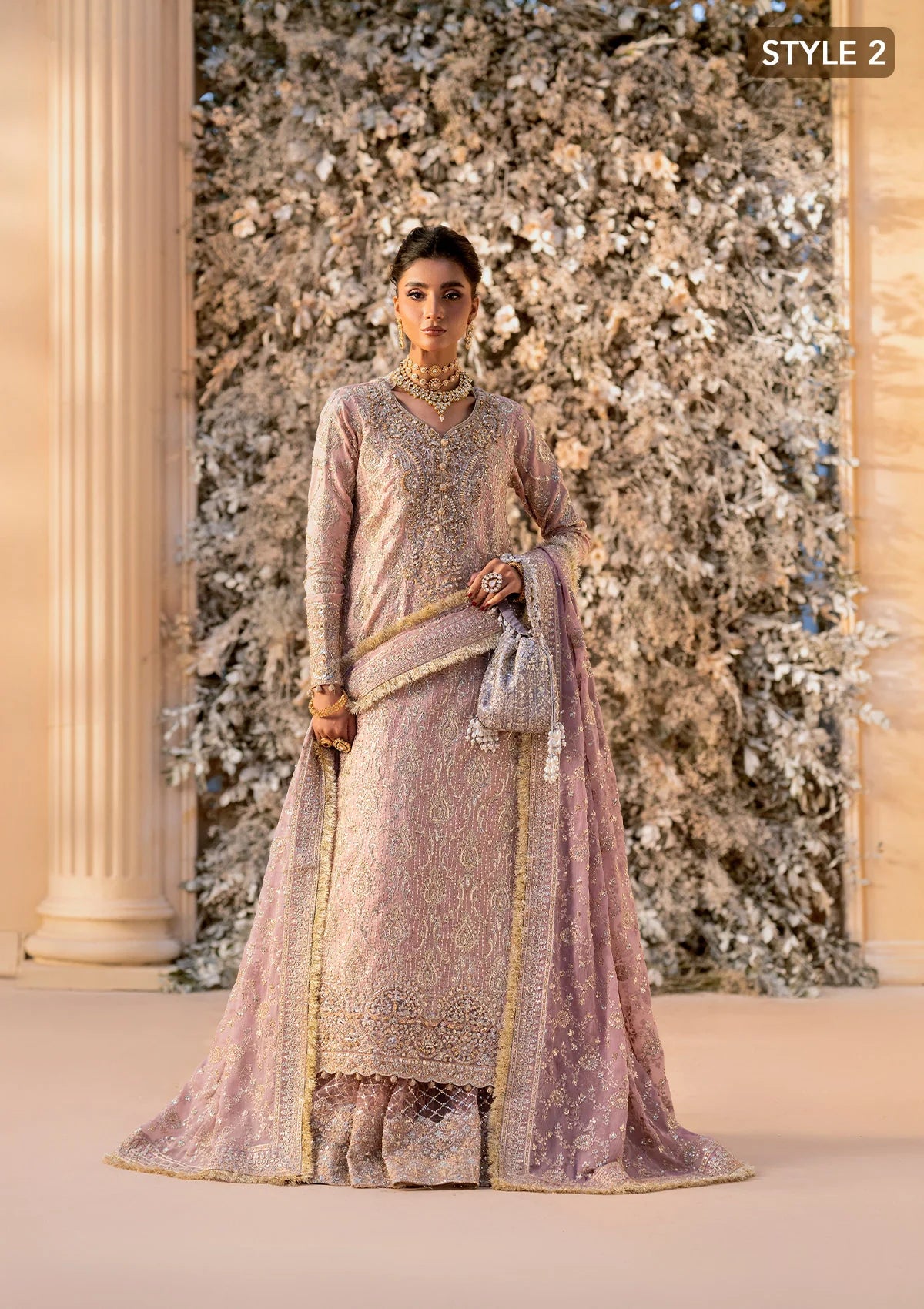 Elegant khaadi net ensemble with embellished organza neckline, detailed borders, masoori silk pants, and chiffon dupatta. Styled as angrakha with gharara or side-slit long shirt with crushed frock.