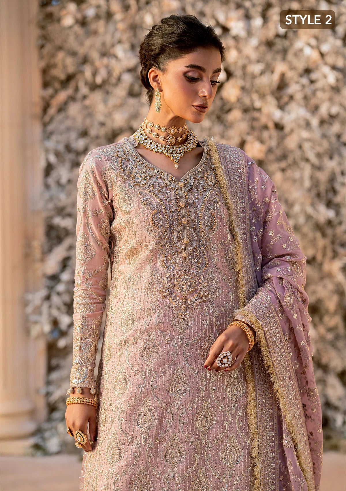 Elegant khaadi net ensemble with embellished organza neckline, detailed borders, masoori silk pants, and chiffon dupatta. Styled as angrakha with gharara or side-slit long shirt with crushed frock.