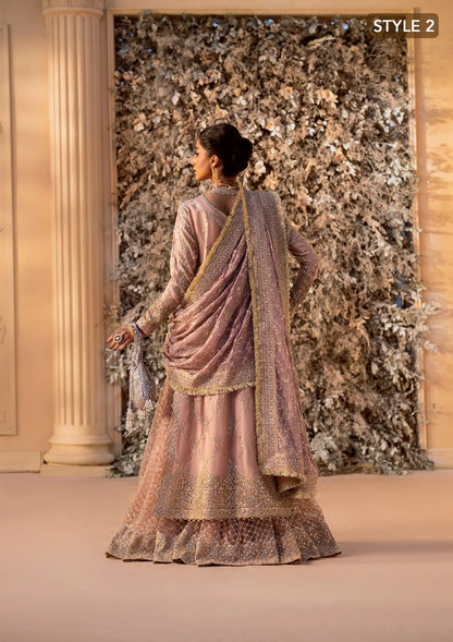 Elegant khaadi net ensemble with embellished organza neckline, detailed borders, masoori silk pants, and chiffon dupatta. Styled as angrakha with gharara or side-slit long shirt with crushed frock.