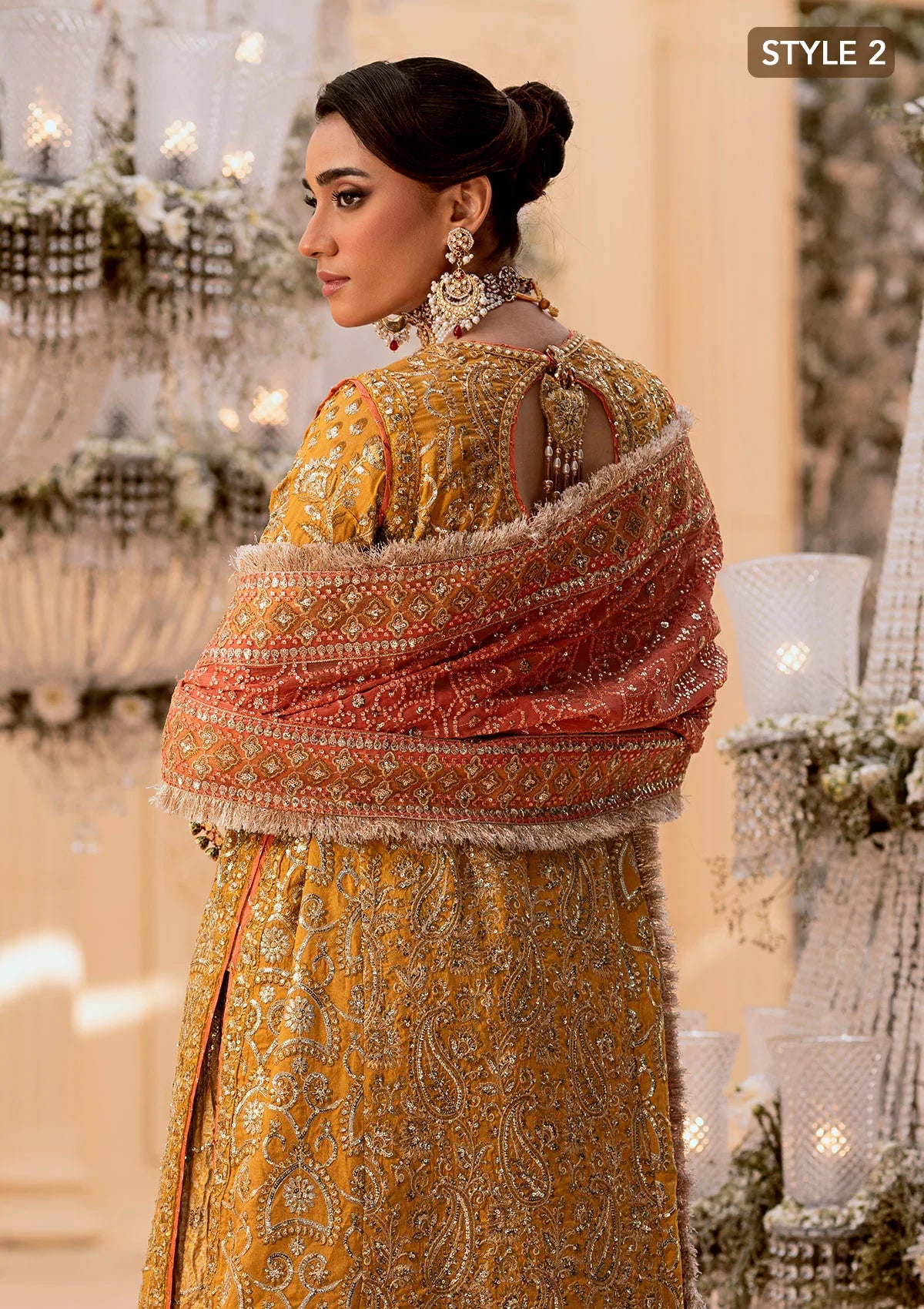 Graceful khaadi net ensemble with embellished organza neckline, embroidered jamawaar pants, and a chiffon dupatta. Styled with farshi gharara or crushed sharara for festive elegance.