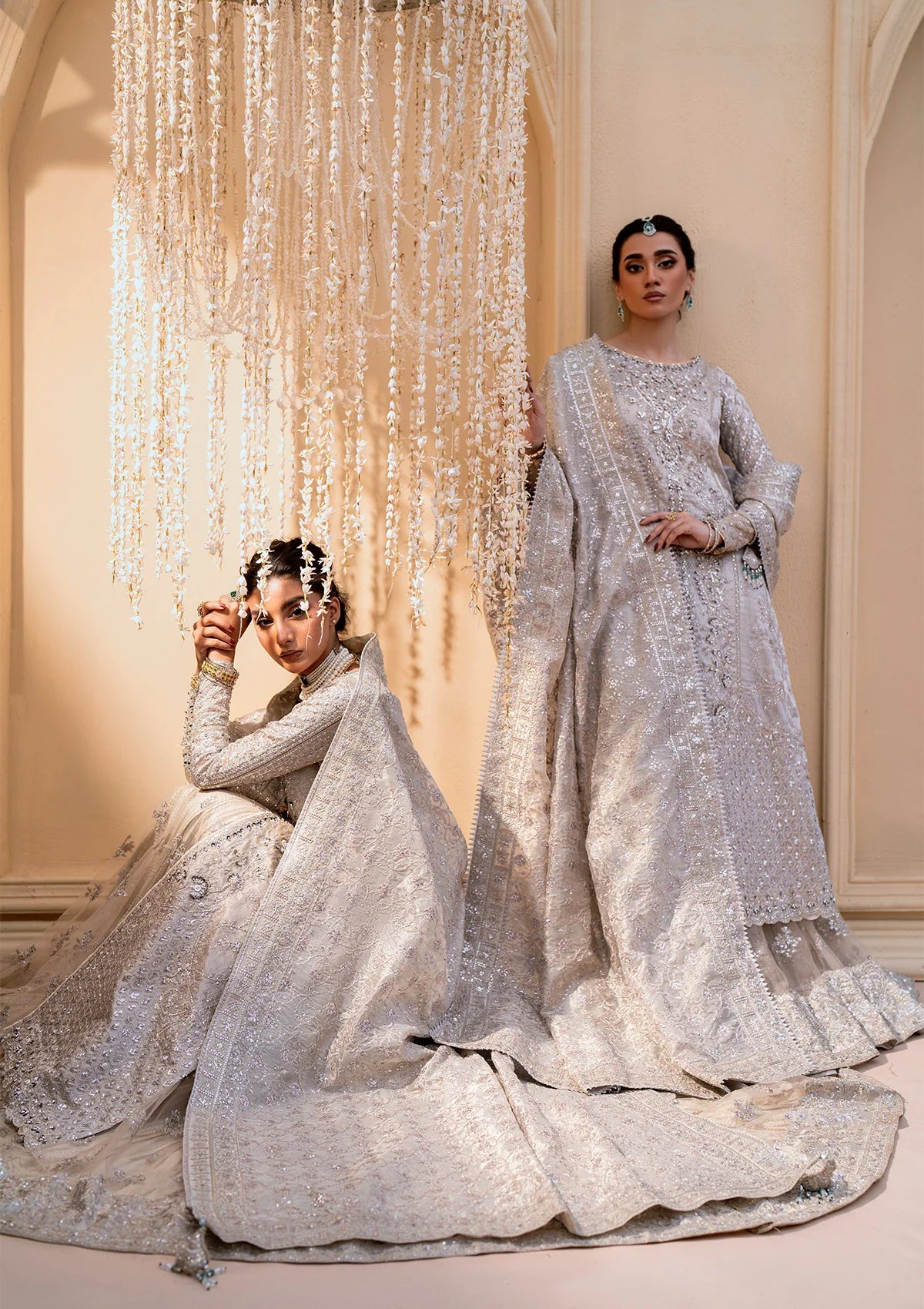 Opulent kundan zari ensemble with embellished panels, intricate jaal work, tissue borders, masoori silk pants, and an embroidered tissue dupatta. Styled as open-front shirt with crushed skirt or side-slit open shirt with crushed frock.
