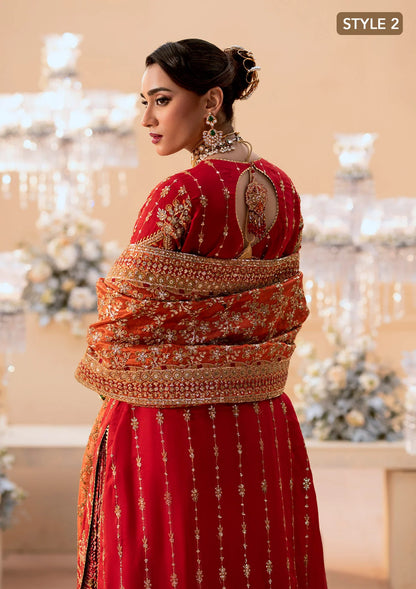 Elegant medium silk ensemble with rich embroidery, embellished borders, embroidered jamawaar pants, and a tissue dupatta. Styled as a long shirt with farshi gharara or crushed gharara for festive wear.