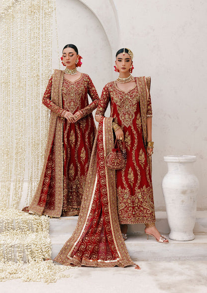 Graceful khaadi net ensemble with embellished neckline, detailed hem patches, organza borders, masoori silk pants, and a chiffon dupatta. Styled as a long shirt with farshi gharara or Hyderabadi shirt with churi pajama.