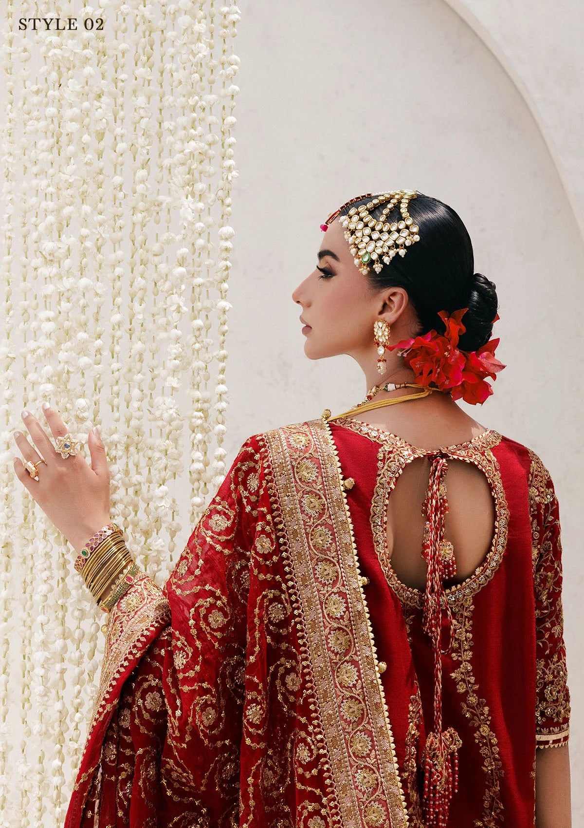Graceful khaadi net ensemble with embellished neckline, detailed hem patches, organza borders, masoori silk pants, and a chiffon dupatta. Styled as a long shirt with farshi gharara or Hyderabadi shirt with churi pajama.