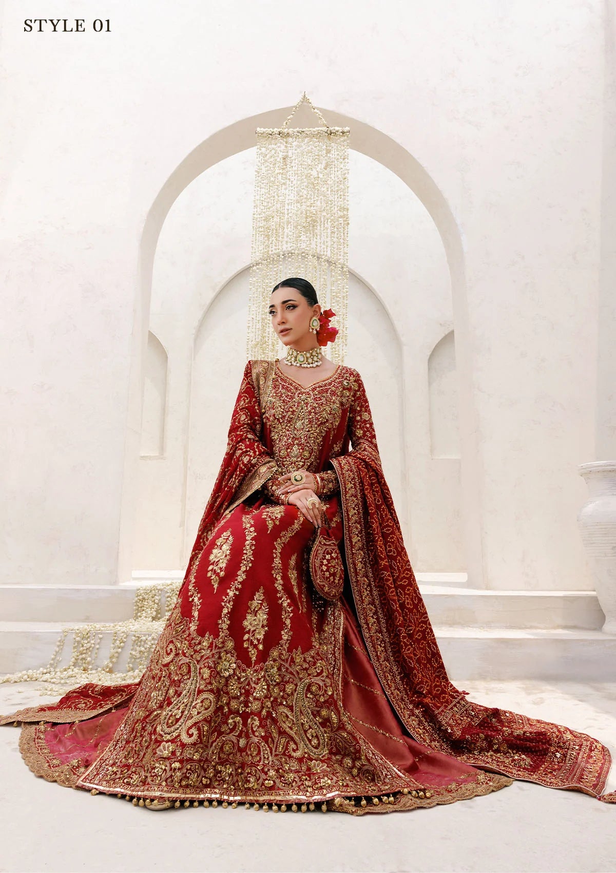 Graceful khaadi net ensemble with embellished neckline, detailed hem patches, organza borders, masoori silk pants, and a chiffon dupatta. Styled as a long shirt with farshi gharara or Hyderabadi shirt with churi pajama.