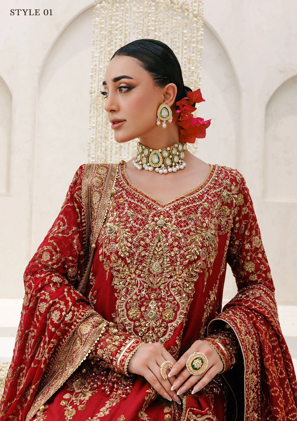 Graceful khaadi net ensemble with embellished neckline, detailed hem patches, organza borders, masoori silk pants, and a chiffon dupatta. Styled as a long shirt with farshi gharara or Hyderabadi shirt with churi pajama.