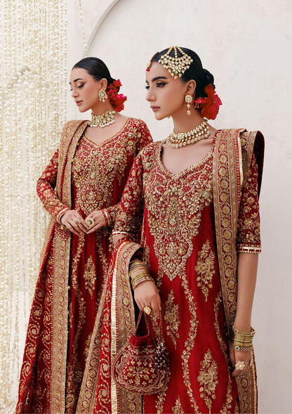 Graceful khaadi net ensemble with embellished neckline, detailed hem patches, organza borders, masoori silk pants, and a chiffon dupatta. Styled as a long shirt with farshi gharara or Hyderabadi shirt with churi pajama.