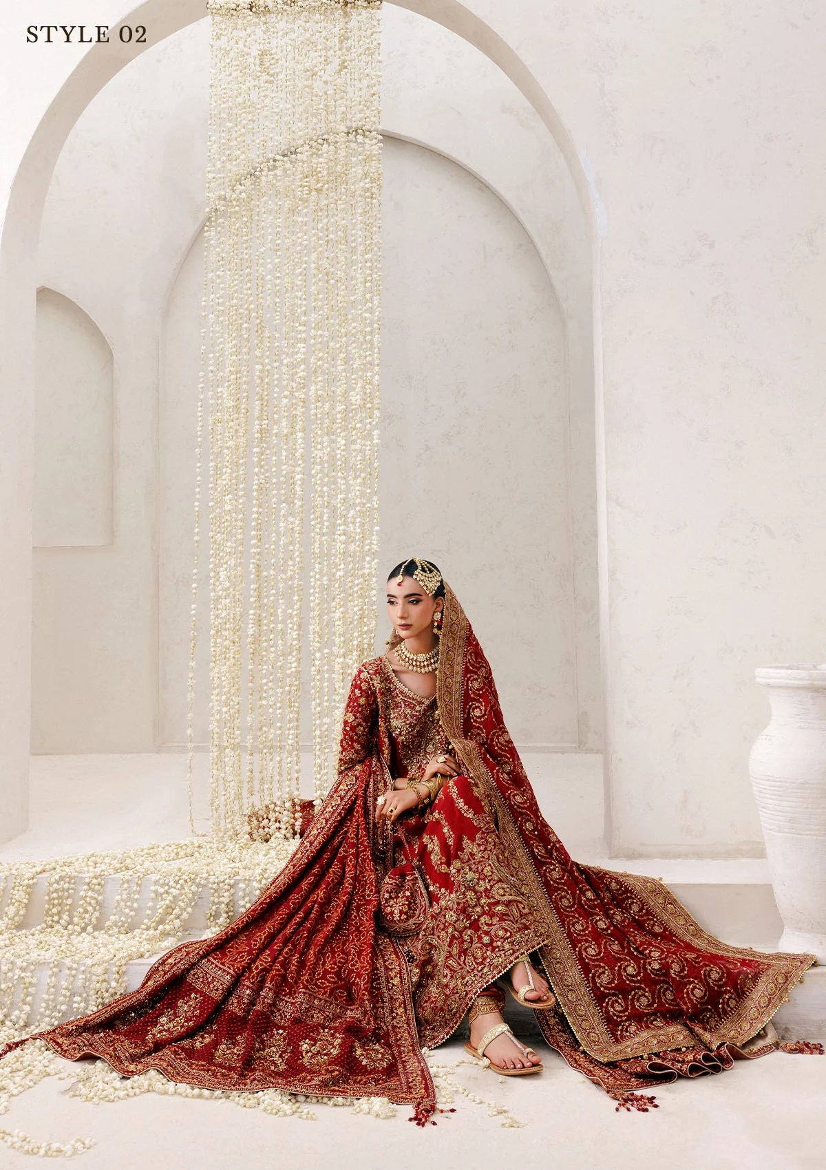 Graceful khaadi net ensemble with embellished neckline, detailed hem patches, organza borders, masoori silk pants, and a chiffon dupatta. Styled as a long shirt with farshi gharara or Hyderabadi shirt with churi pajama.