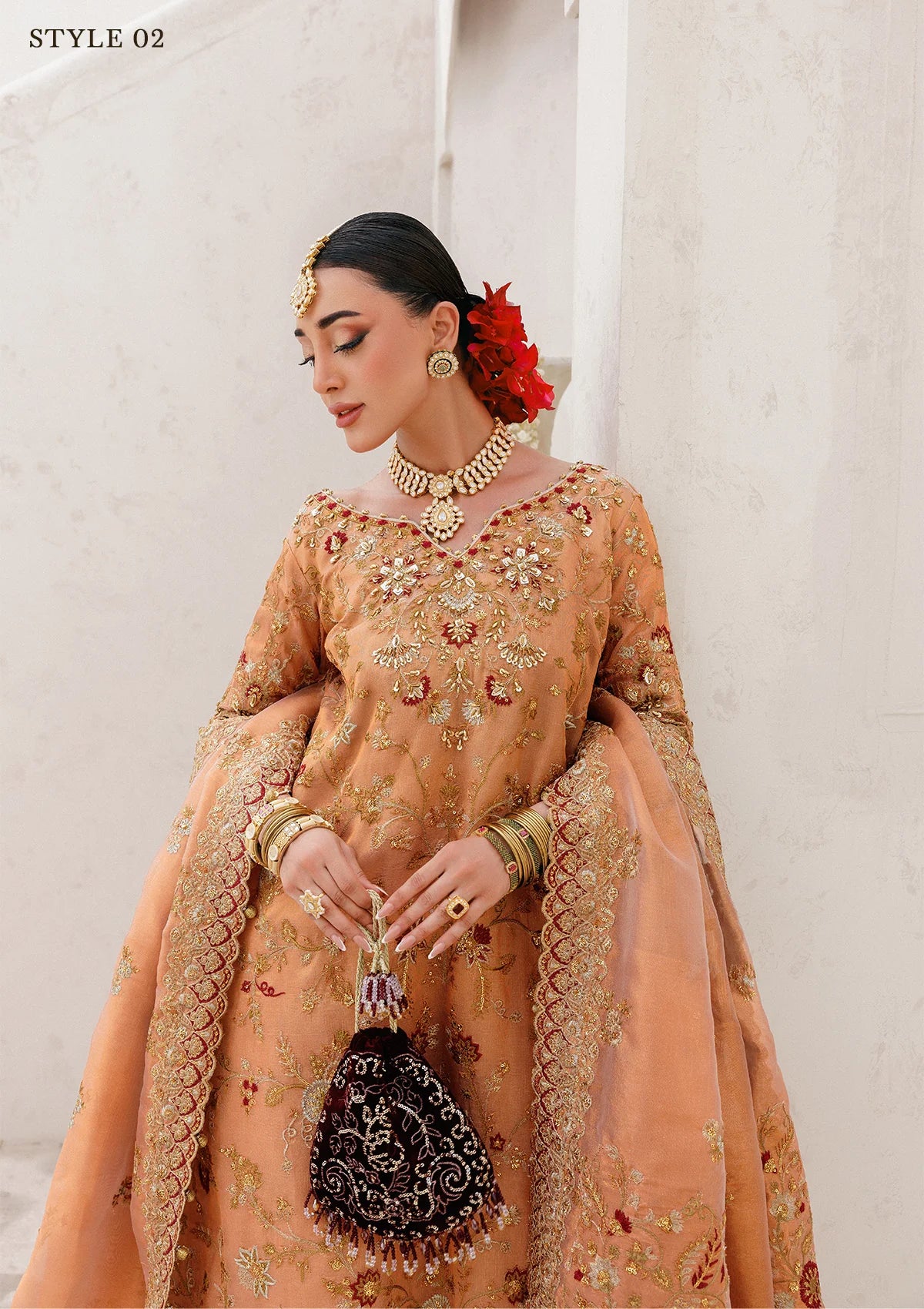 Luxurious tissue ensemble with rich embroidery, embellished borders, jamawar pants, and an embroidered tissue dupatta. Styled as a long shirt with farshi gharara or elegant skirt.