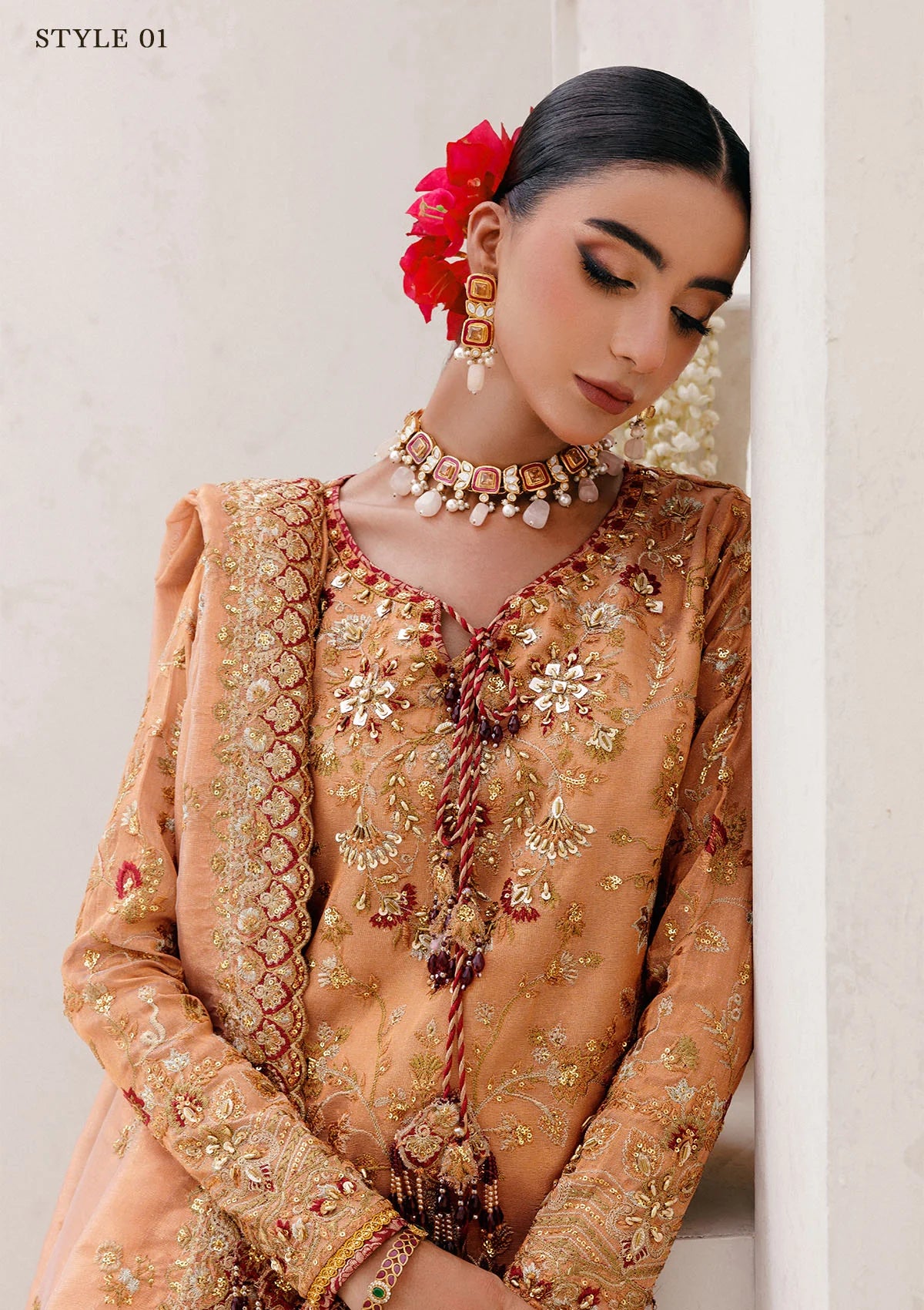 Luxurious tissue ensemble with rich embroidery, embellished borders, jamawar pants, and an embroidered tissue dupatta. Styled as a long shirt with farshi gharara or elegant skirt.