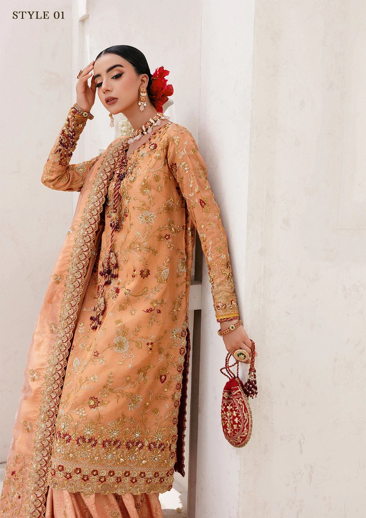 Luxurious tissue ensemble with rich embroidery, embellished borders, jamawar pants, and an embroidered tissue dupatta. Styled as a long shirt with farshi gharara or elegant skirt.