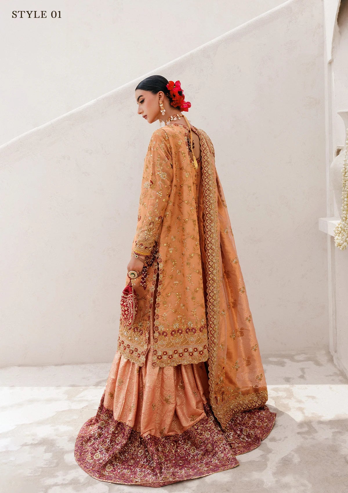 Luxurious tissue ensemble with rich embroidery, embellished borders, jamawar pants, and an embroidered tissue dupatta. Styled as a long shirt with farshi gharara or elegant skirt.