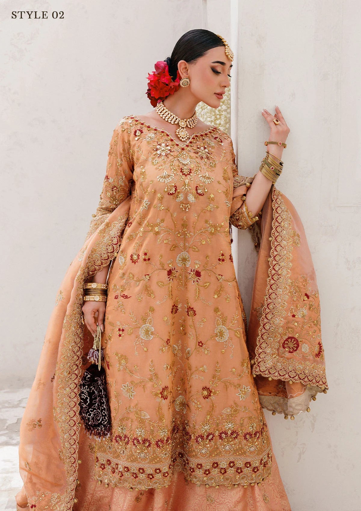 Luxurious tissue ensemble with rich embroidery, embellished borders, jamawar pants, and an embroidered tissue dupatta. Styled as a long shirt with farshi gharara or elegant skirt.