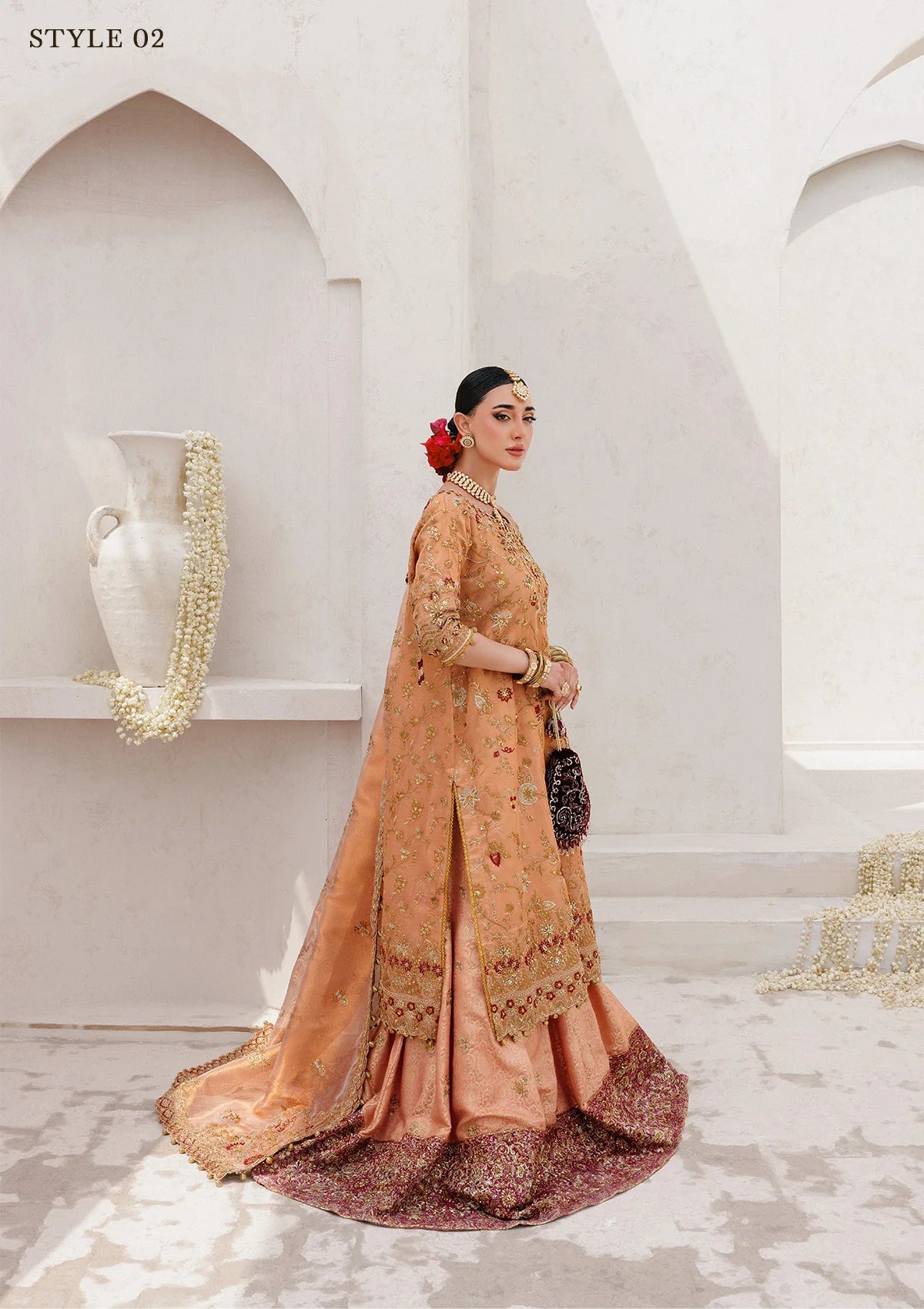 Luxurious tissue ensemble with rich embroidery, embellished borders, jamawar pants, and an embroidered tissue dupatta. Styled as a long shirt with farshi gharara or elegant skirt.