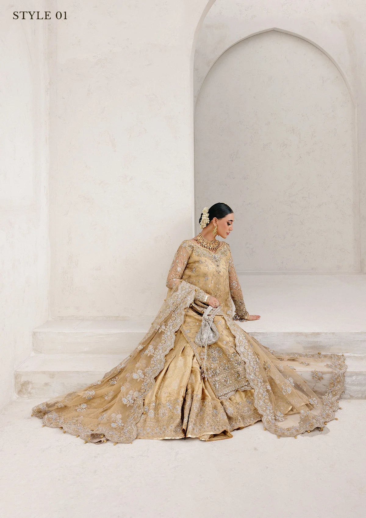 Elegant embroidered net ensemble with tissue neckline, rich borders, jamawar pants, and an embroidered net dupatta. Styled as a long shirt with farshi gharara or side-slit long shirt with crushed frock.