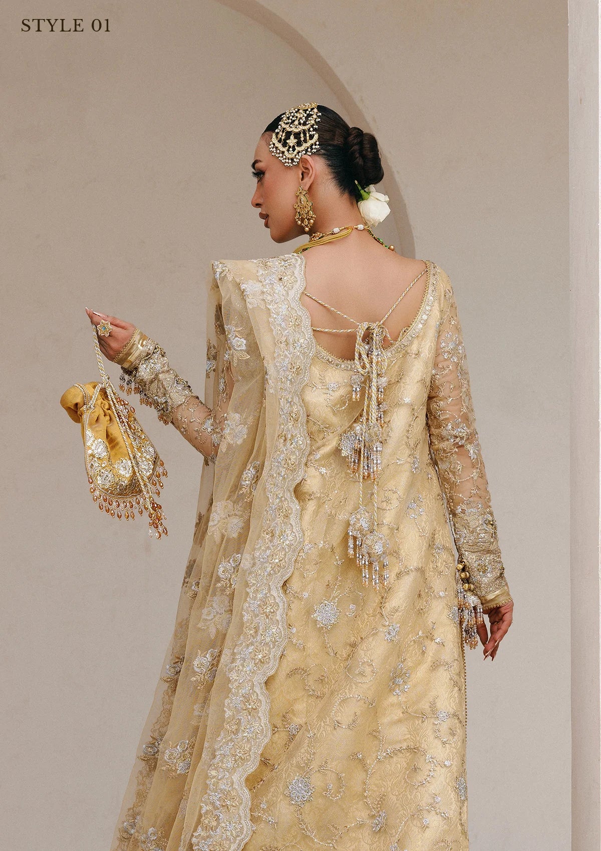 Elegant embroidered net ensemble with tissue neckline, rich borders, jamawar pants, and an embroidered net dupatta. Styled as a long shirt with farshi gharara or side-slit long shirt with crushed frock.