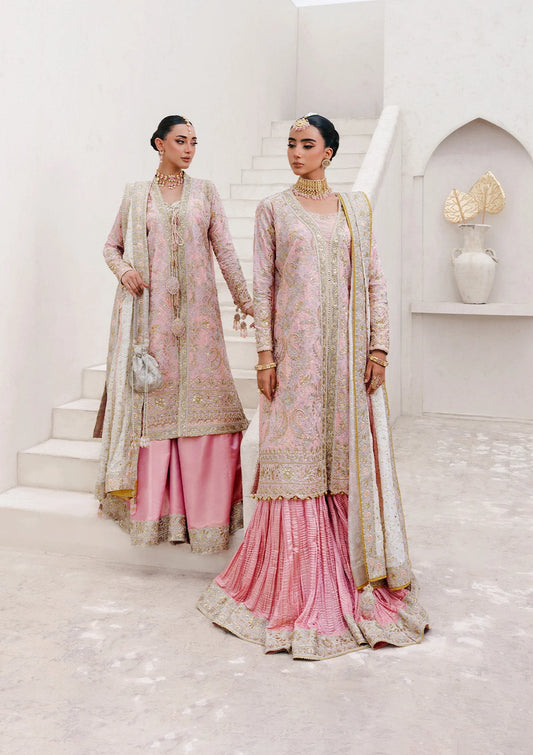 Refined katan silk ensemble with embroidered yoke, embellished borders, masoori silk pants, and a medium silk dupatta. Styled as open-front long shirt with crushed gharara or sharara.