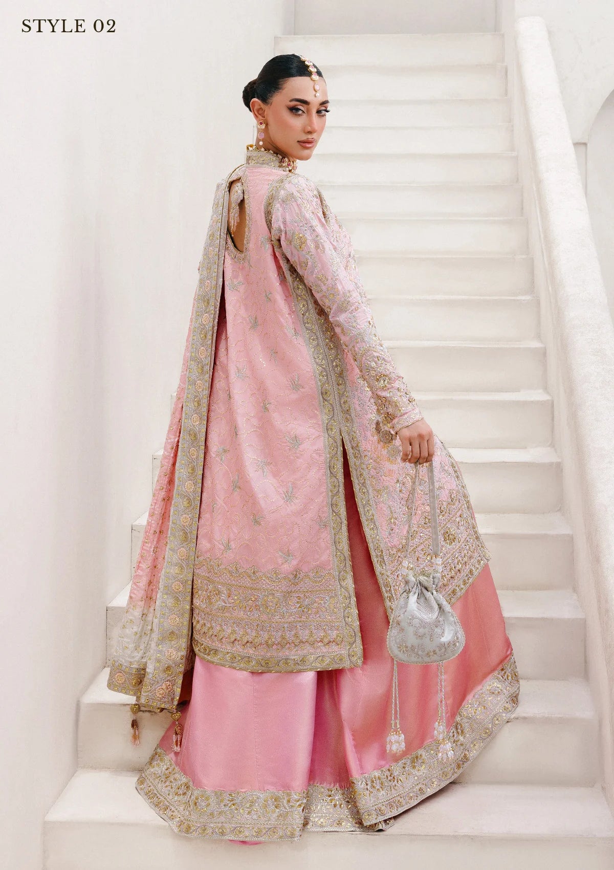 Refined katan silk ensemble with embroidered yoke, embellished borders, masoori silk pants, and a medium silk dupatta. Styled as open-front long shirt with crushed gharara or sharara.