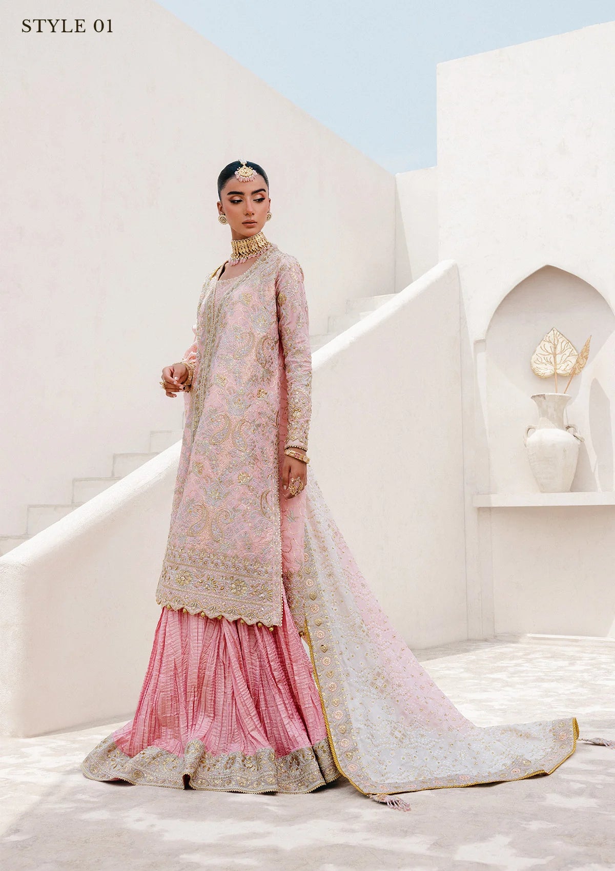 Refined katan silk ensemble with embroidered yoke, embellished borders, masoori silk pants, and a medium silk dupatta. Styled as open-front long shirt with crushed gharara or sharara.
