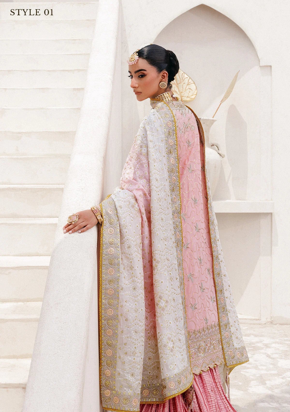 Refined katan silk ensemble with embroidered yoke, embellished borders, masoori silk pants, and a medium silk dupatta. Styled as open-front long shirt with crushed gharara or sharara.