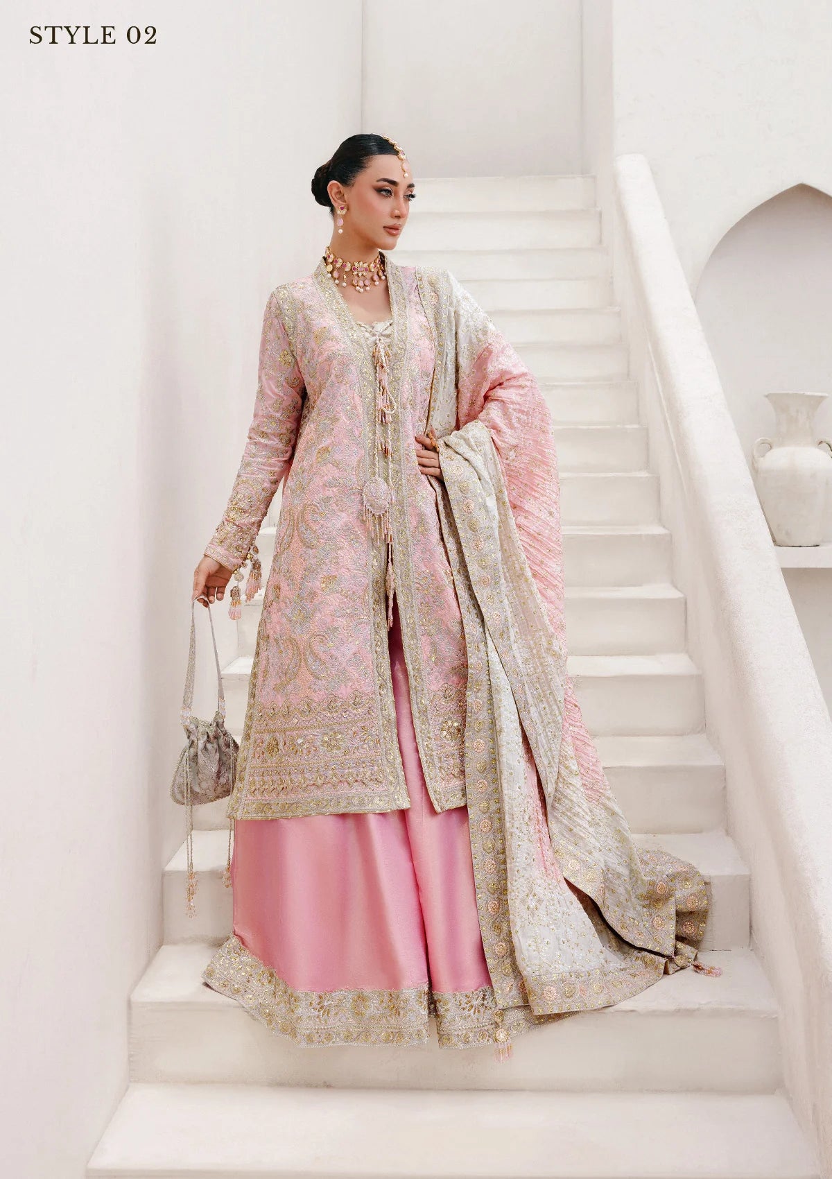 Refined katan silk ensemble with embroidered yoke, embellished borders, masoori silk pants, and a medium silk dupatta. Styled as open-front long shirt with crushed gharara or sharara.