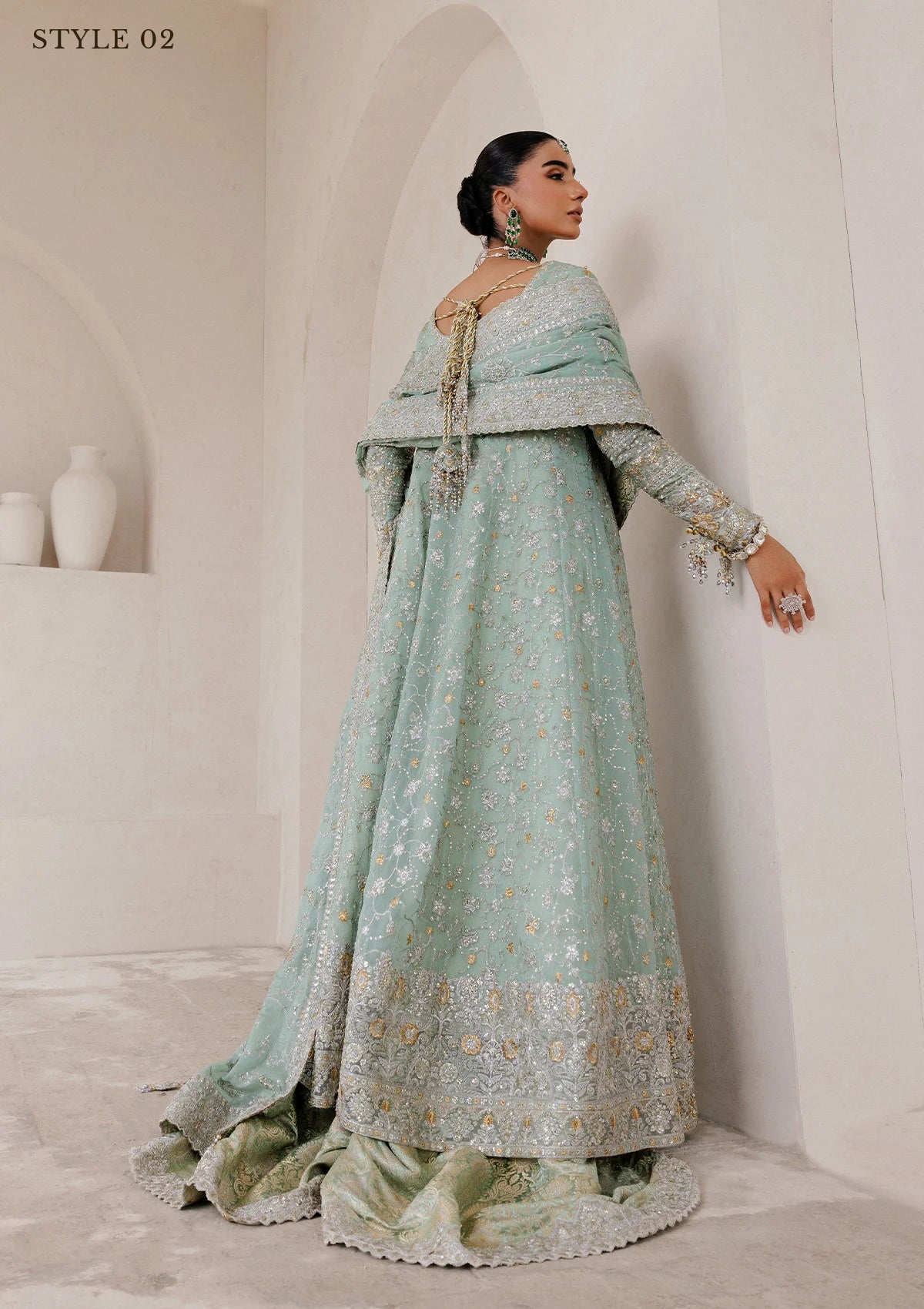 Elegant embroidered chiffon ensemble with embellished organza neckline, rich borders, jamawar pants, and chiffon dupatta. Styled as angrakha with skirt or kalidar open front with farshi gharara.