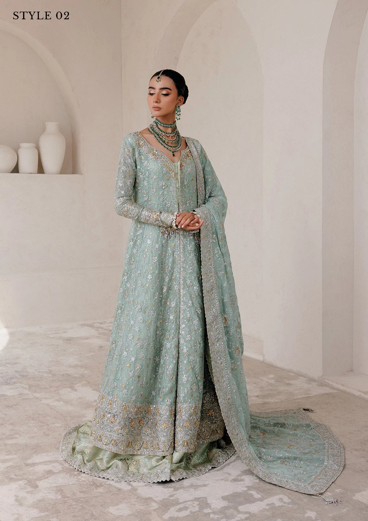 Elegant embroidered chiffon ensemble with embellished organza neckline, rich borders, jamawar pants, and chiffon dupatta. Styled as angrakha with skirt or kalidar open front with farshi gharara.