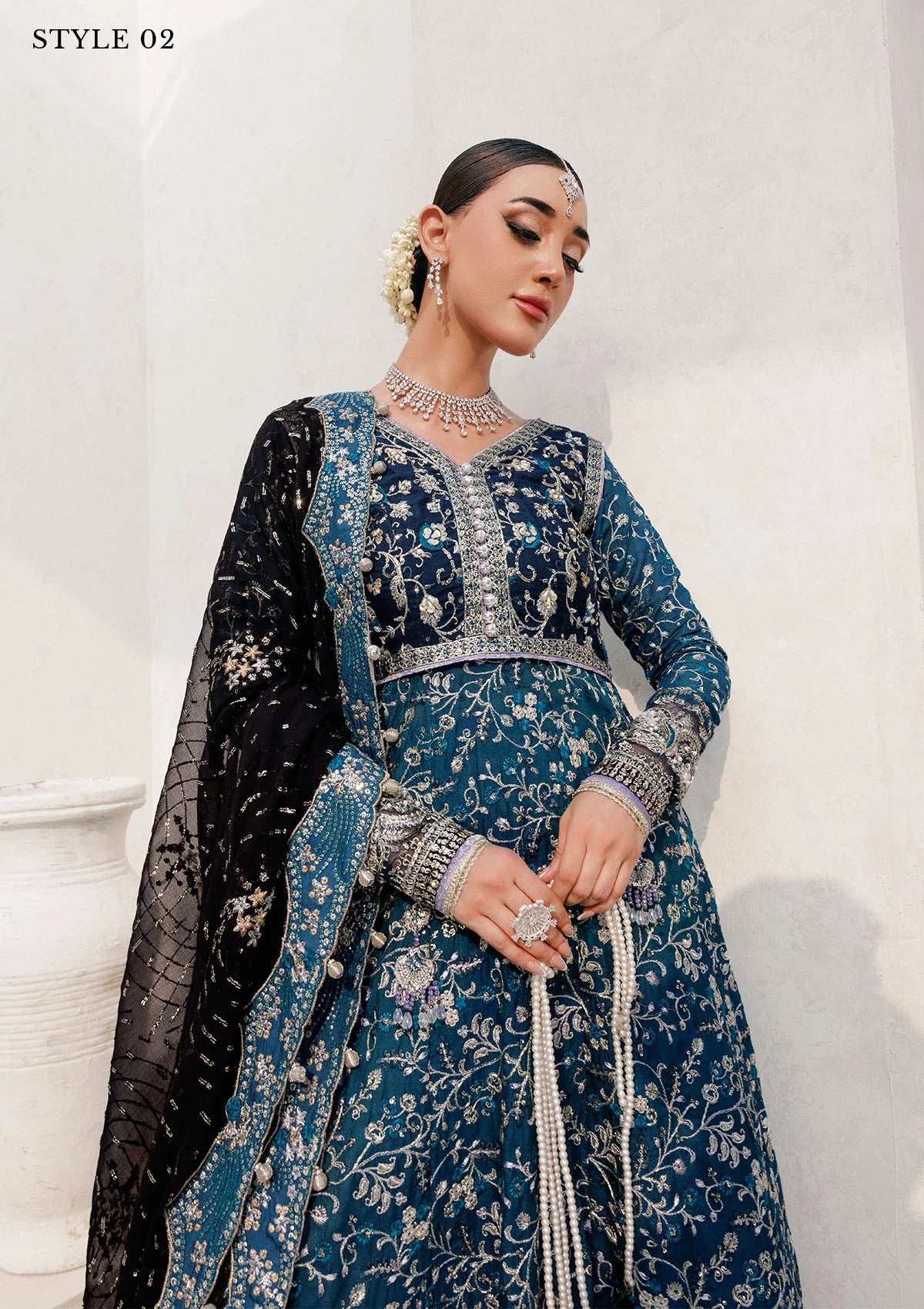 Elegant khaadi net ensemble with embellished bodice, organza and silk neckline finishing, masoori silk pants, and chiffon dupatta. Styled as angrakha with sharara or kalidar with skirt.