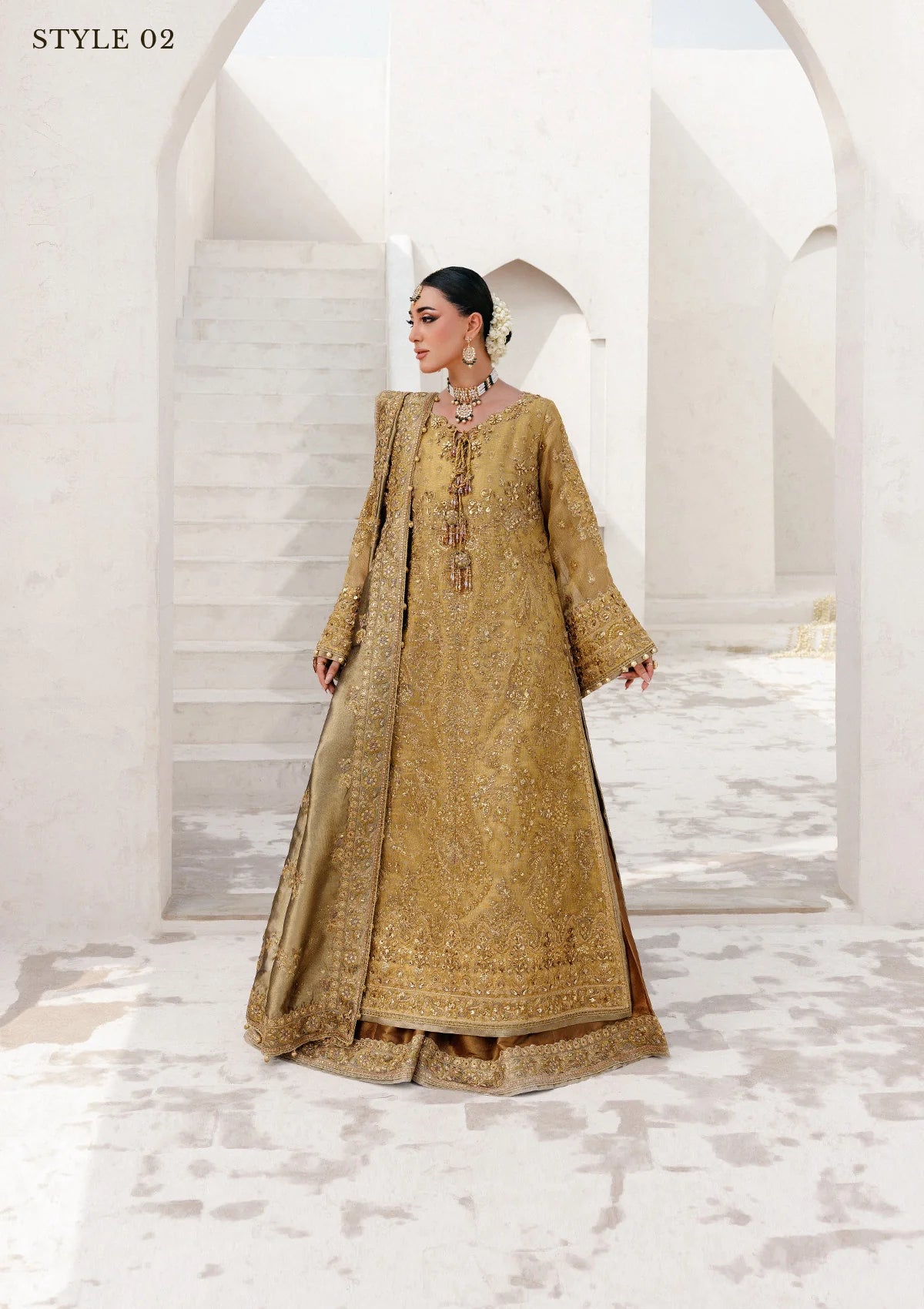 Graceful zari net ensemble with embellished bodice, tissue neckline and borders, masoori silk pants, and an embroidered tissue dupatta. Styled as open-front with skirt or long shirt with sharara.