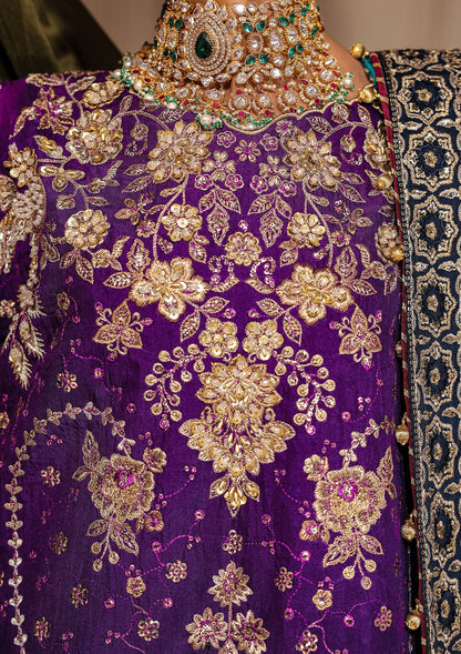 Elegant purple medium silk dress with embellished embroidery, organza borders and sleeves. Paired with masoori silk pants and embroidered silk dupatta.