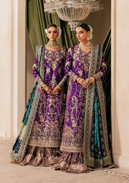 Elegant purple medium silk dress with embellished embroidery, organza borders and sleeves. Paired with masoori silk pants and embroidered silk dupatta.
