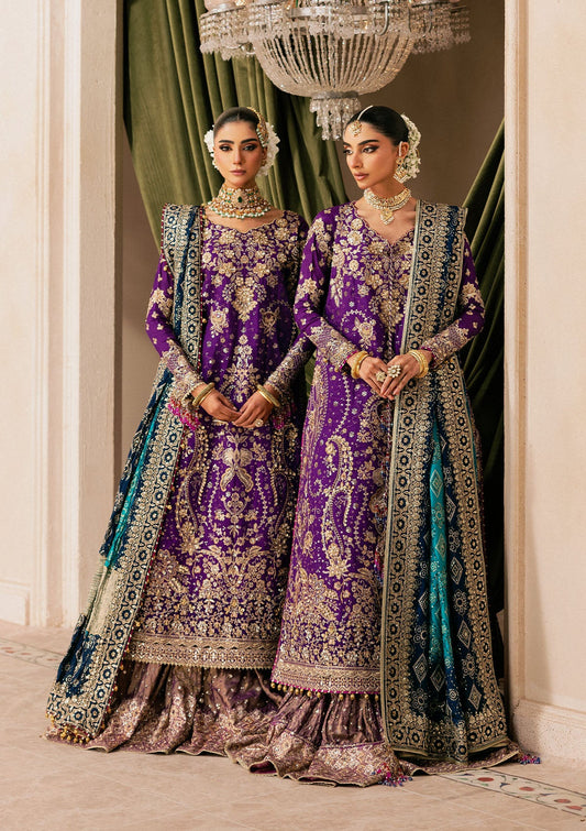 Elegant purple medium silk dress with embellished embroidery, organza borders and sleeves. Paired with masoori silk pants and embroidered silk dupatta.