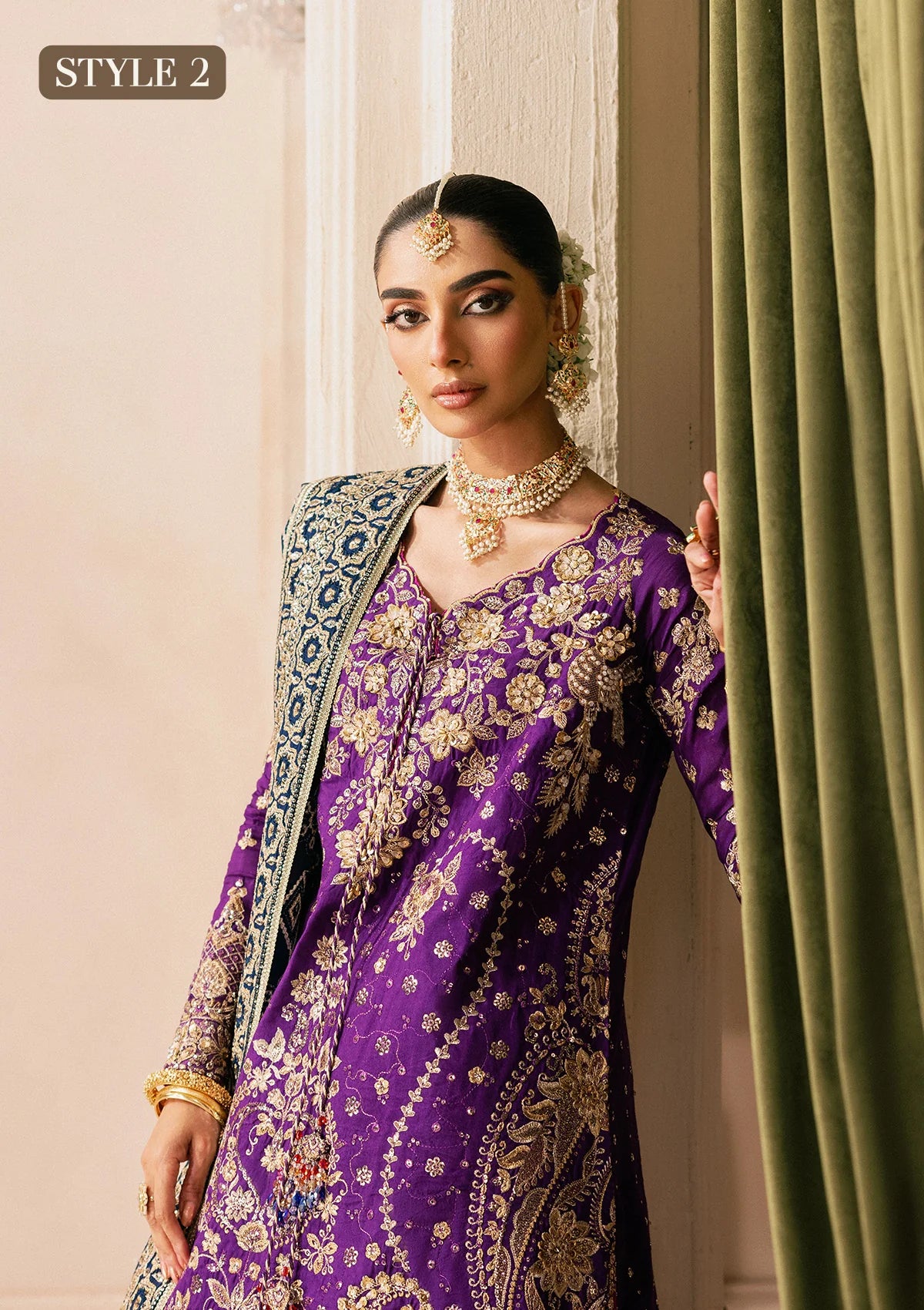 Elegant purple medium silk dress with embellished embroidery, organza borders and sleeves. Paired with masoori silk pants and embroidered silk dupatta.