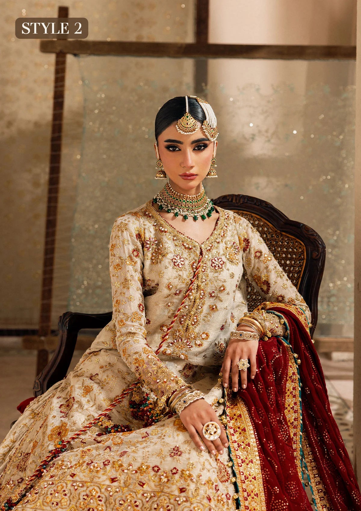 Elegant off white zari net dress with embellished embroidery, organza borders and sleeves. Paired with jamawar pants and chiffon dupatta.